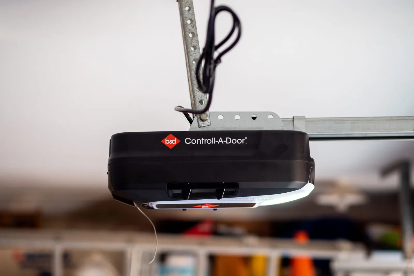 B&D Controll-A-Door Smart garage door opener mounted on a garage ceiling