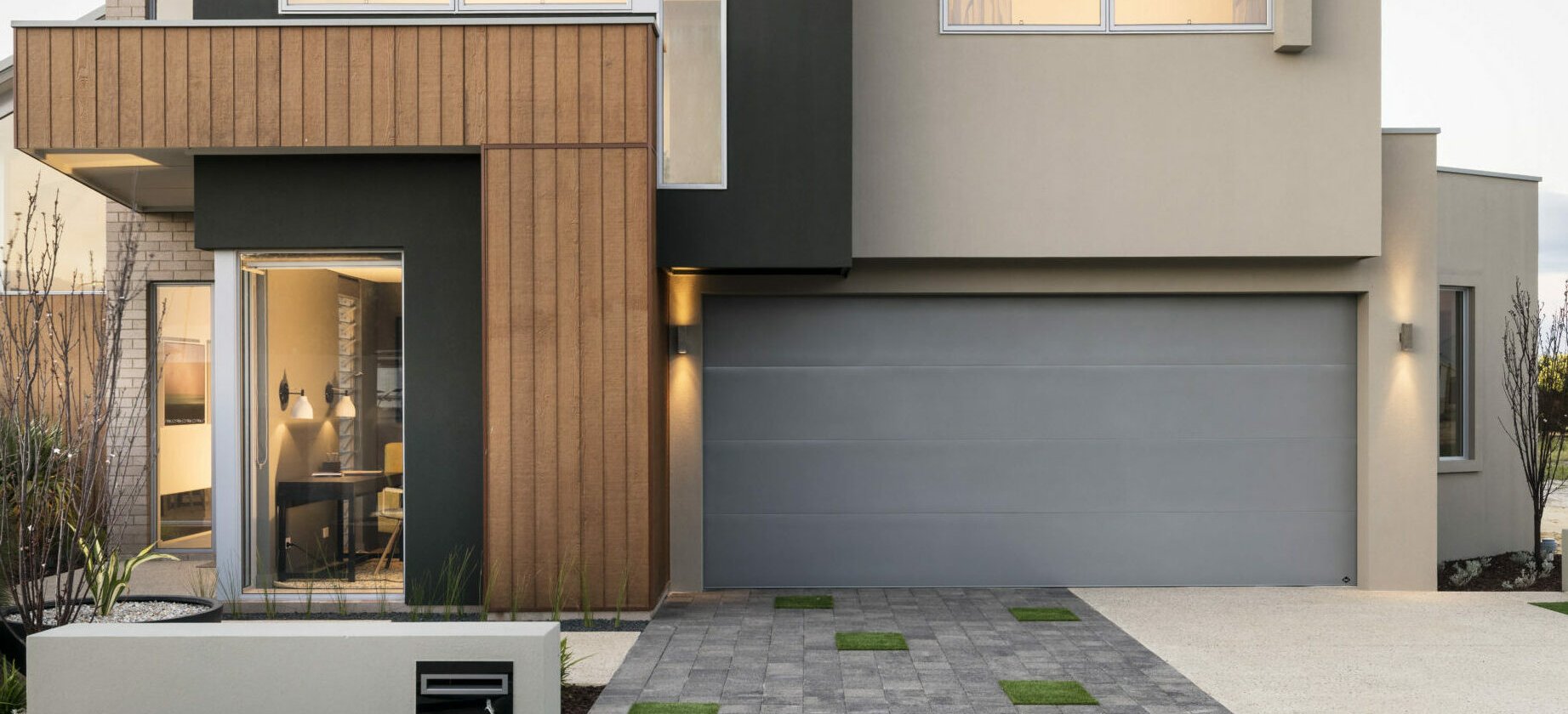 Modern two storey home with a grey B&D Panelift Icon sectional garage door